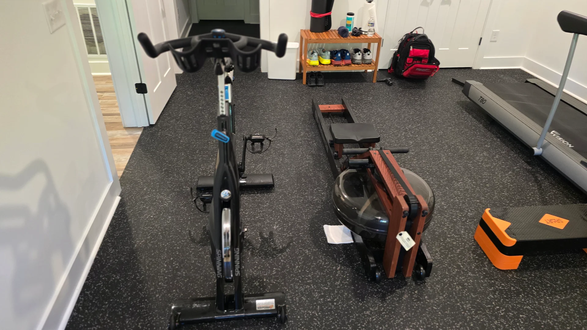 Dedicated residential home gym with cardio and strength equipment